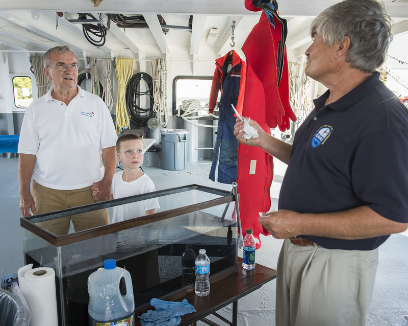Delaware Bay and River Cooperative expert Keith Lee talks about equipment used during oil spills and techniques for absorbing and containing them aboard the Oil Spill Response Vehicle. BY DENY HOWETH